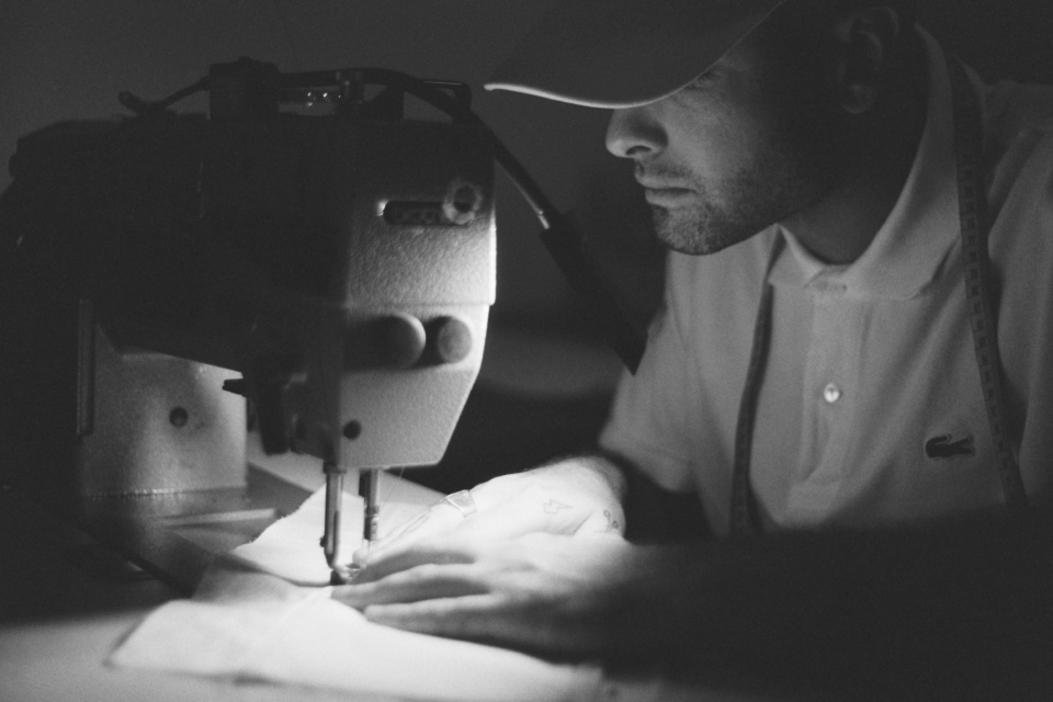 Alex sewing in his workshop